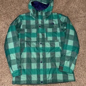 The North Face Green Checkered Ski Jacket with navy blue lining.